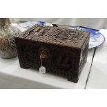 Camphorwood box, the hinged cover and sides carved in relief with figures and boats,