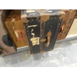 Large metal trunk labelled Watajoy, London Made, various travelling labels including P&O,