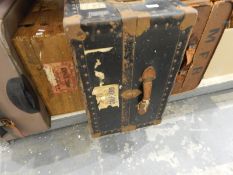 Large metal trunk labelled Watajoy, London Made, various travelling labels including P&O,