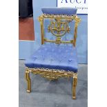 Continental-style gilt painted salon/bedroom chair with padded crest rail, carved lion's masks,