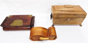 Early 19th century rosewood tea caddy of sarcophagus shape with lion mask ring handles and four paw