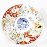 Japanese Imari porcelain charger painted with cranes in landscape, phoenix and floral borders, 39.