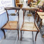 Three Regency mahogany and brass inlaid bar back dining chairs with cane seats and another with