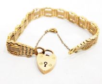 (Lot withdrawn) Rose gold fancy gate bracelet, having scalloped pierced borders and padlock clasp,