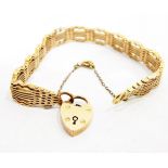 (Lot withdrawn) Rose gold fancy gate bracelet, having scalloped pierced borders and padlock clasp,