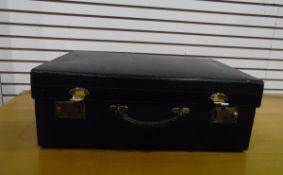 Black leather travelling case blindstamped gilt letters 'A J Wares Limited'(?),