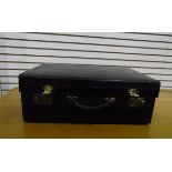 Black leather travelling case blindstamped gilt letters 'A J Wares Limited'(?),