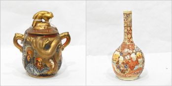 Japanese Satsuma two-handled lidded vase decorated with immortals and embossed with lizard,