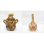 Japanese Satsuma two-handled lidded vase decorated with immortals and embossed with lizard,