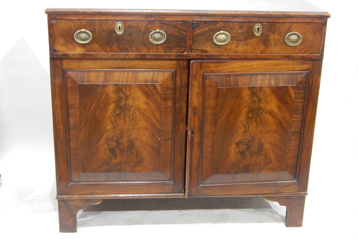 19th century dwarf mahogany side cabinet having two drawers over two field panelled doors,