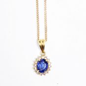 Gold, sapphire and diamond pendant, oval, set oval sapphire surrounded by small diamonds,