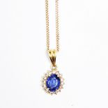 Gold, sapphire and diamond pendant, oval, set oval sapphire surrounded by small diamonds,