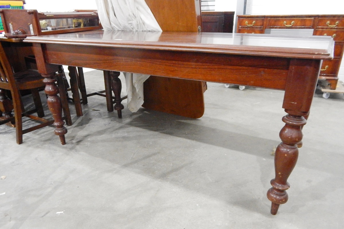Late 19th century mahogany dining table with moulded edge and on turned supports,