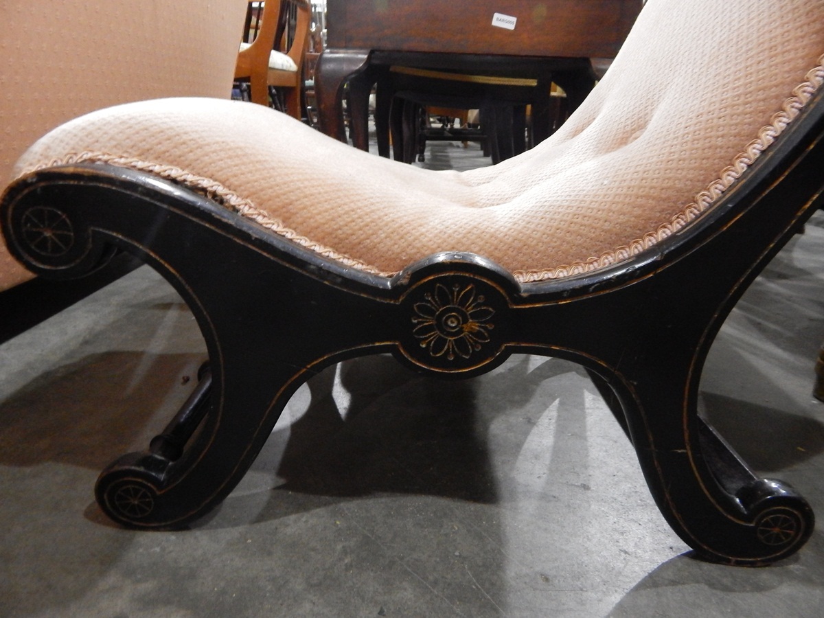 Victorian ebonised nursing chair on scrolled supports