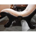 Victorian ebonised nursing chair on scrolled supports