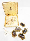 Five banded agate panels from a Victorian bracelet, in scrolling gilt metal mounts,
