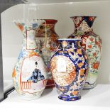 Japanese porcelain vase, baluster-shaped with robed figure beside balcony in shaped panels,
