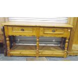 Pine dresser base fitted with two drawers, over turned supports,