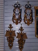 NEW LOT: Two pairs of reproduction gilt mirror wall sconces, one pair modelled as lyres,