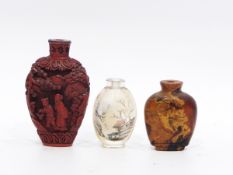 Chinese cinnabar lacquer snuff bottle decorated in relief with figures in a mountainous landscape,