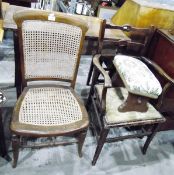 Dark stained ladderback elbow chair, a cane panelled chair, a footstool, a music cabinet,