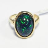 9ct gold and opal ring set oval cabochon stone