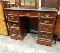 Lady's Edwardian kneehole writing desk having an arrangement of nine drawers,