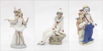 Two Lladro porcelain figure groups of clowns and a Nao Lladro figure of a seated clown (3)