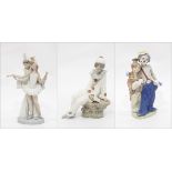 Two Lladro porcelain figure groups of clowns and a Nao Lladro figure of a seated clown (3)