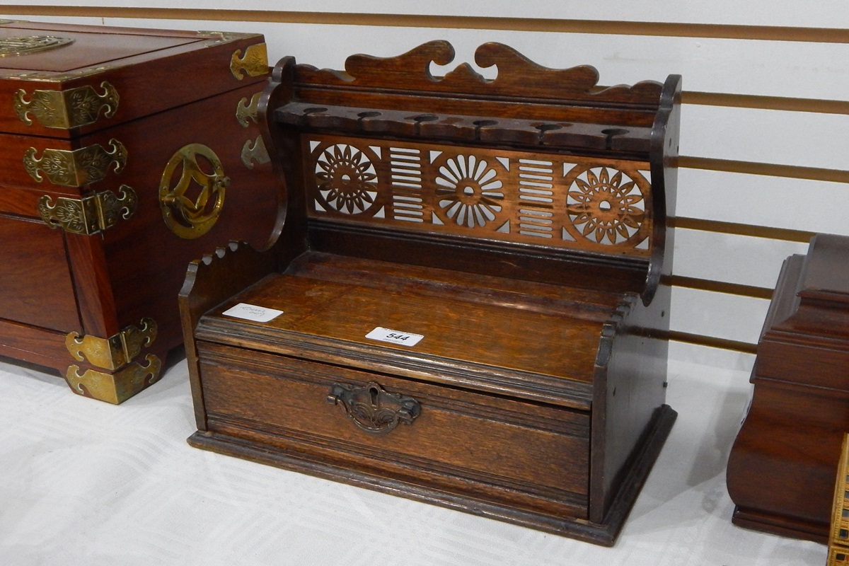 Late 19th century oak smoker's pipe rack with open fretwork brass panel and fitted drawer,