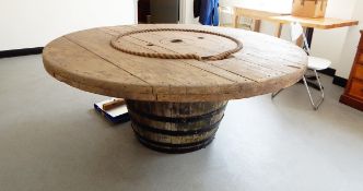 Large circular rustic patio table, with inset rope design on a cider barrel pedestal support,