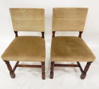 Set of 10 oak framed dining chairs, probably by Rackstraw, with studded upholstered seats and back,