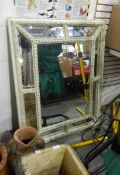 Large carved wood framed mirror with glass panels,