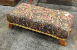 Long footstool with floral tapestry upholstery, on short square legs,