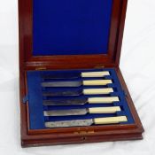Boxed set of 12 yellow-handled stainless steel knives in mahogany case and a quantity of various