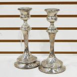 Pair of George V silver table candlesticks, each with thistle-pattern sconce,