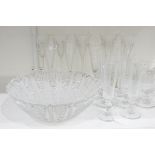 Five cut glass wine glasses and a set of four early 20th century knopped stem faceted champagne