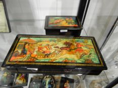 Mstori Russian lacquer glove-style box of rectangular form depicting figures leaving a house on