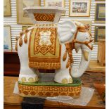 Ceramic garden/conservatory seat modelled as an elephant carrying a howdah, 57.