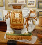 Ceramic garden/conservatory seat modelled as an elephant carrying a howdah, 57.
