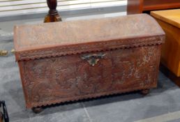Tooled leather clad South American domed top trunk with cast brass carrying handles