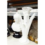 White ceramic stand in natural form of a lily supporting the white ceramic bust of a Victorian