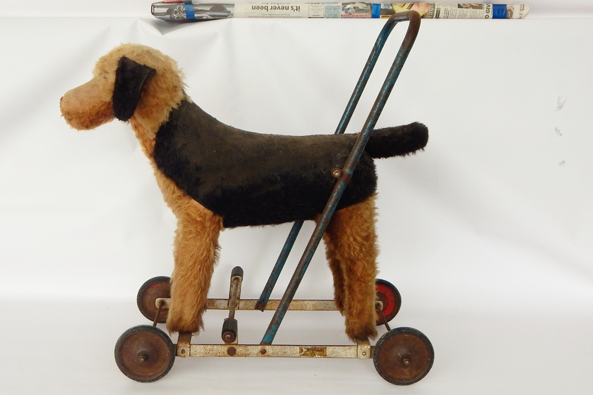 Plush bodied push-along dog (worn)