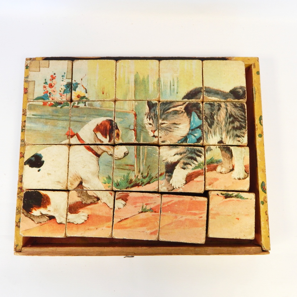 Early 20th century printed bricks puzzle set with accompanying prints