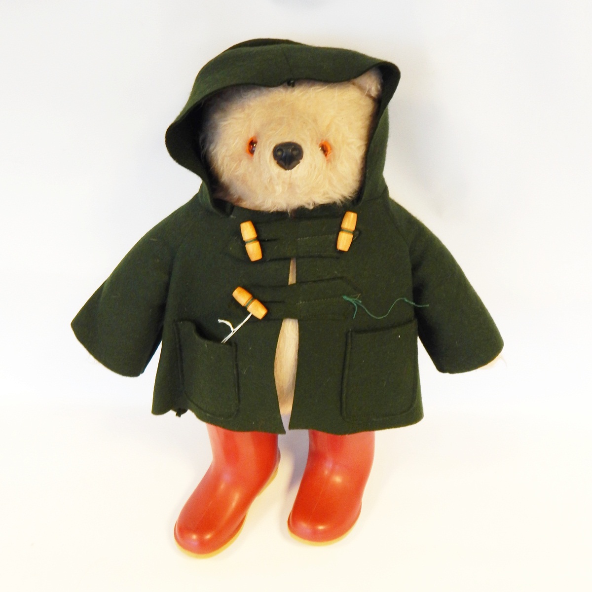Paddington Bear with mohair-type fur, green felt jacket and red wellingtons,