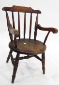 19th century ash and elm child's spindle back armchair, with circular solid seat,