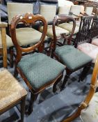 Mahogany trefoil-topped balloon-back dining chair on French cabriole supports and another