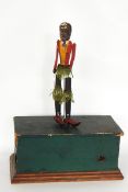 Perry & Co painted wooden automaton 'Negro' dancer with painted wooden base containing movement and