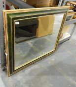 Wall mirror within a green and gilt frame,