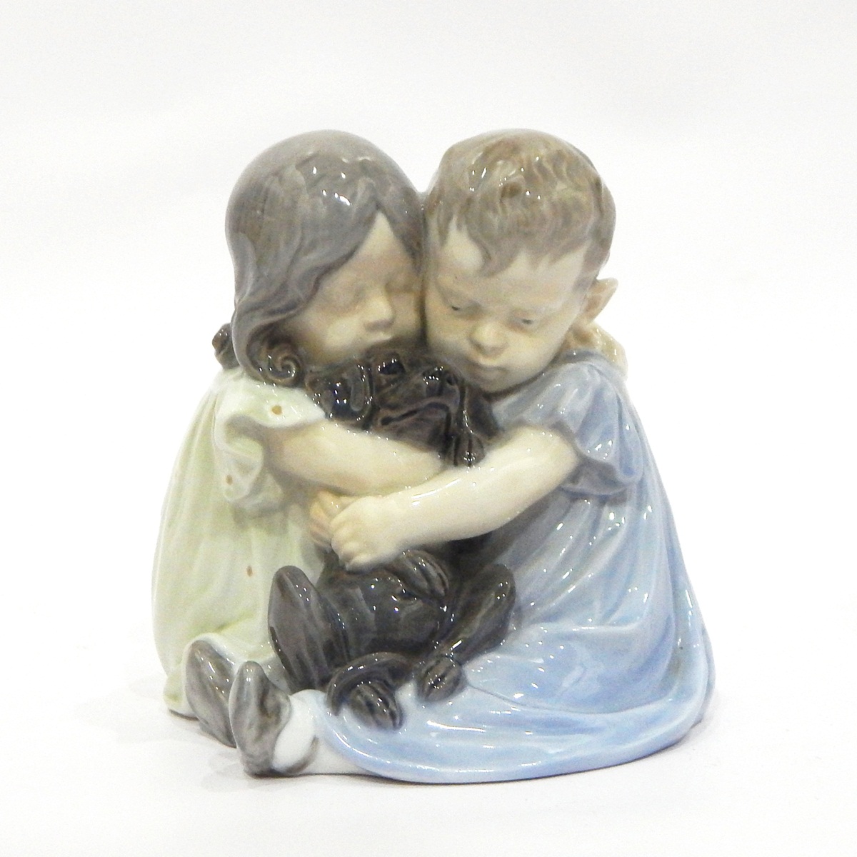 Royal Copenhagen porcelain figure group of children with puppy together with another of a crawling